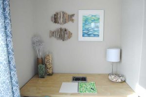 beach house desk with art