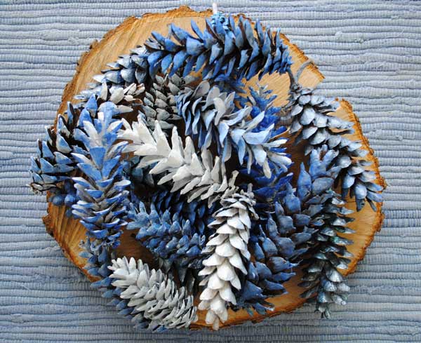 blue painted pine cones